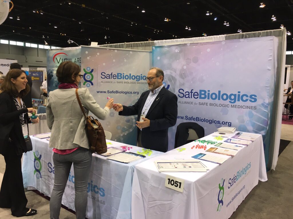 Dr. Gewanter answers questions from conference attendees as well as distributing literature and promotional syringe pens.
